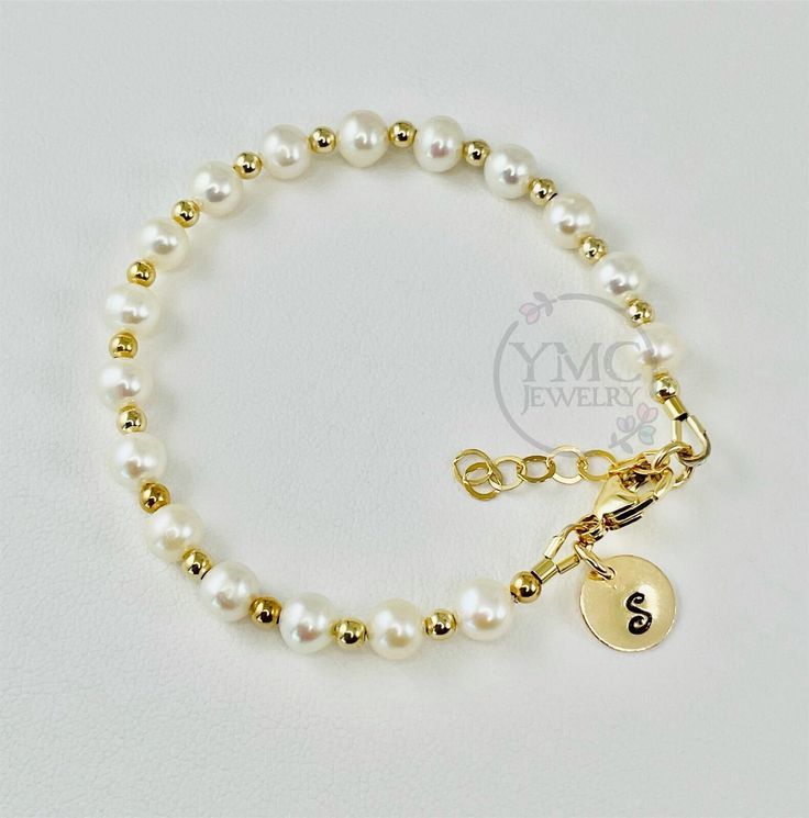 Freshwater Pearl Stackable Kids Bracelet,Gold Pearl Bracelet For Kids,Gold Pearl Bracelet,Stackable Freshwater Pearl Bracelet,Newborn Infant Kids Bracelet, Real Pearl  Gold Bracelet,Real Pearl Bracelet, Stackable Gold Bracelet,Dainty Gold Bracelet,Gold Layering Mom Bracelet,     The list is for the first picture. This dainty cute freshwater pearl bracelet It was made with 3mm smooth 14Kt Gold Filled beads, 9mm disc, potato freshwater pearls (5.5-6mm),  and finished with small lobster clasp.  The Personalized Adjustable Classic Pearl Bracelet, Classic Personalized Adjustable Pearl Bracelet, Adjustable Hypoallergenic Pearl Bracelet For Mother's Day, Classic Adjustable Personalized Pearl Bracelet, Elegant Handmade Charm Bracelet For Mother's Day, Adjustable Beaded Bracelets For Birthday, Adjustable Hypoallergenic Round Name Bracelet, Hypoallergenic Charm Bracelet For Birthday, Dainty White Round Charm Bracelet