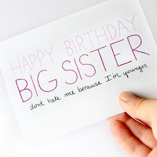 a hand holding a card that says happy birthday big sister