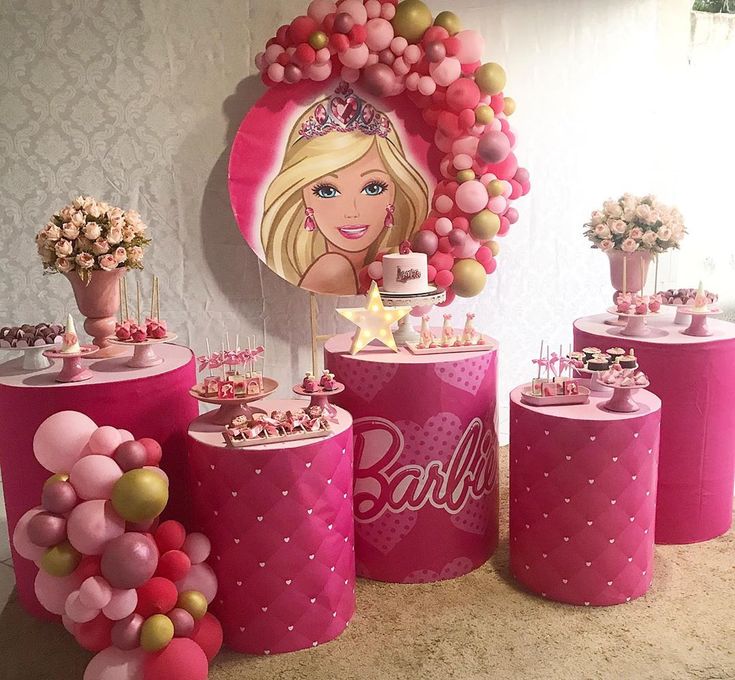 a barbie birthday party with pink and gold decorations