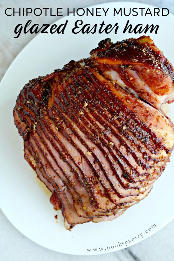 a close up of a piece of meat on a plate with the words chipotle honey mustard glazed easter ham