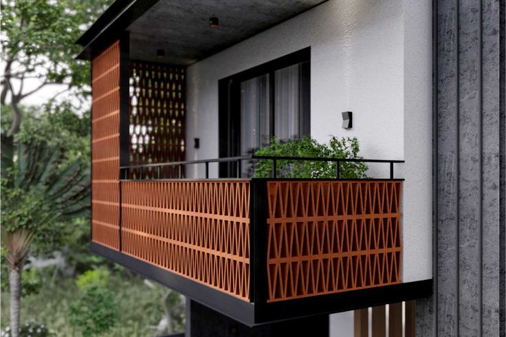 a balcony with an iron railing and wooden balconies on the side of it