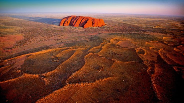 an aerial view of aye rock in the outback