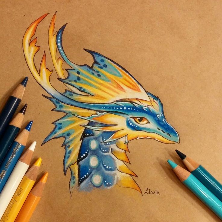 a drawing of a dragon head with blue and yellow wings