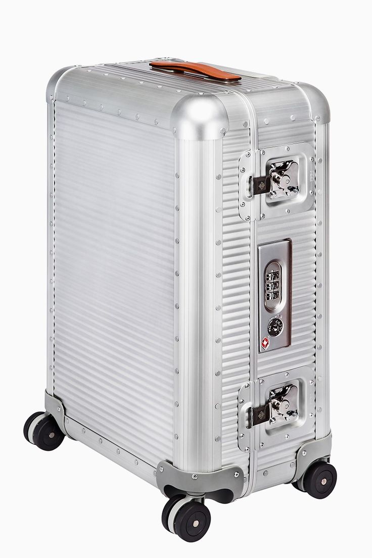 a silver suitcase with wheels and an orange handle