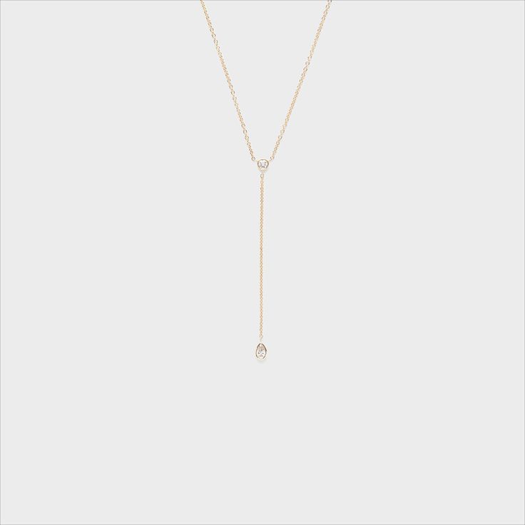 This dainty and sophisticated piece is the perfect addition to any collection! Delicate White Diamond Necklace With Delicate Chain, White Diamond Necklace With Delicate Chain, Classic Adjustable 14k Gold Necklace, Classic Adjustable White Gold Necklace, Delicate White Diamond Necklace With Clavicle Chain, White 14k Gold Diamond Necklace With Clavicle Chain, 14k Gold White Diamond Necklace With Clavicle Chain, White Diamond Necklace With 14k Gold Clavicle Chain, Dainty 14k Gold Long Drop Necklaces