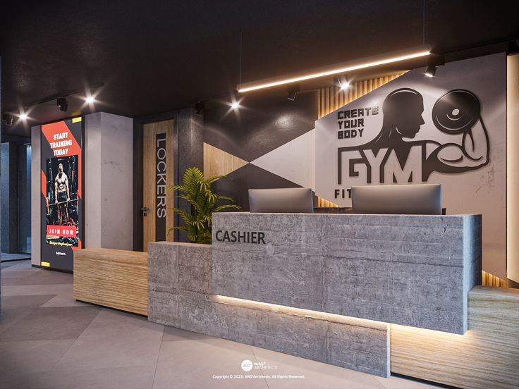 the front desk of a gym is lit up with dim lighting and signs above it