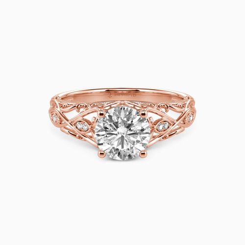 a rose gold engagement ring with a round diamond in the center