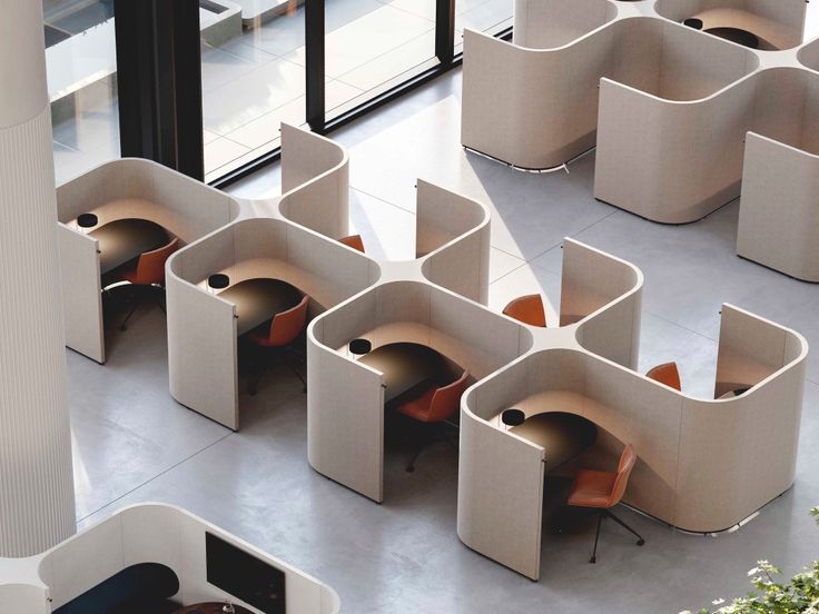 there are many chairs and tables in the room that is designed to look like they have been made out of cardboard