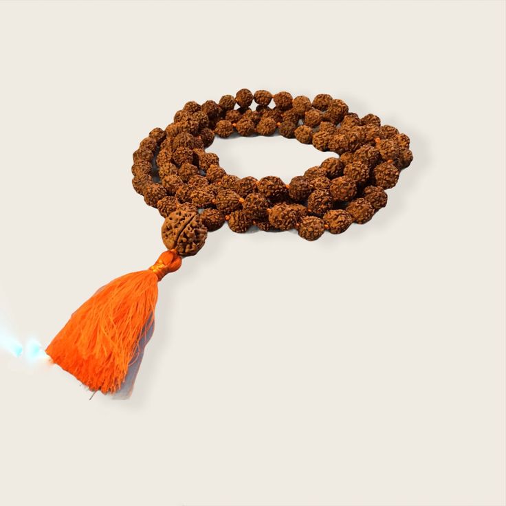 Rudraksha Mala necklace 10mm with 15mm guru bead. Hand Knotted with a cotton tassel. Hindu mala for meditation or chanting. Hand Wrapped Mala With Round Beads For Meditation, Hand Wrapped Round Beads Mala For Meditation, Hand Wrapped Mala For Meditation, Hand-strung Spiritual Mala For Puja, Hand-strung Spiritual Necklace For Puja, Hand-strung Spiritual Necklaces For Puja, Spiritual Hand-strung Necklaces For Puja, Spiritual Mala With 8mm Beads For Rituals, Holistic Necklaces With 8mm Beads For Festivals