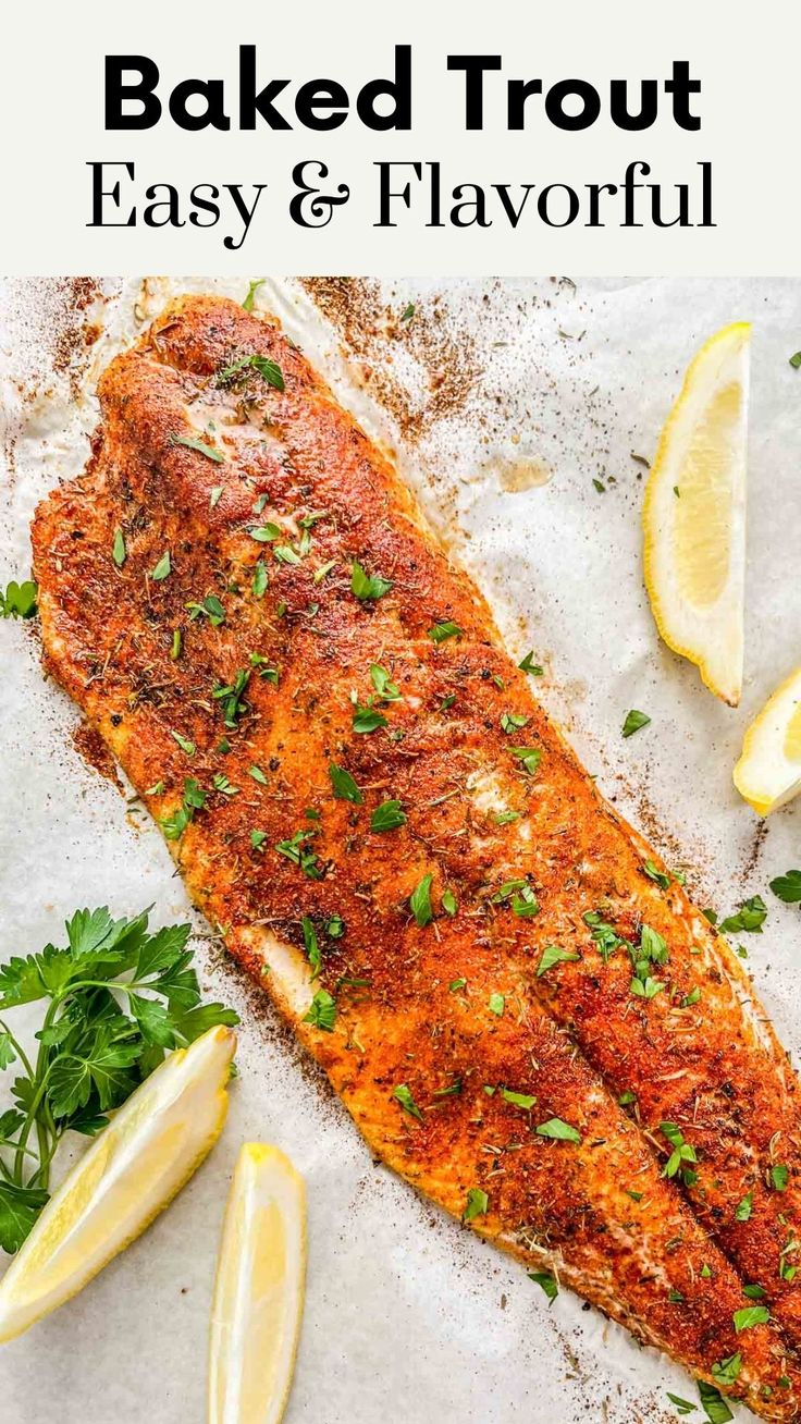 baked fish with lemons and parsley on the side