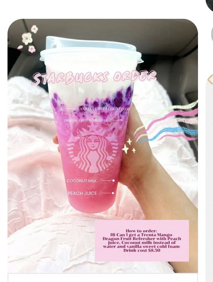 a pink starbucks cup with purple flowers on it