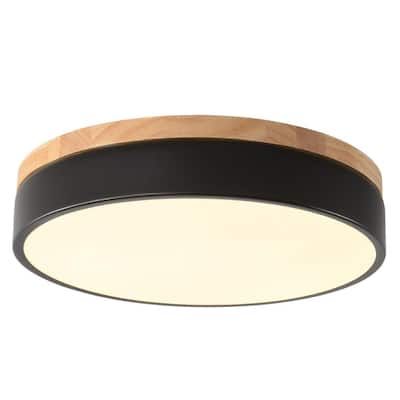 a black and wood ceiling light on a white background