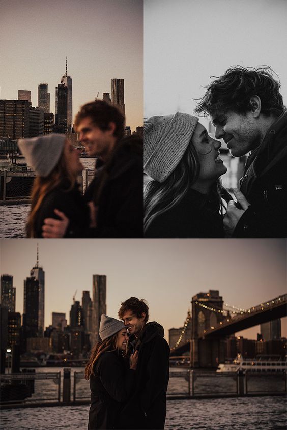 two people standing next to each other in front of the water and cityscape