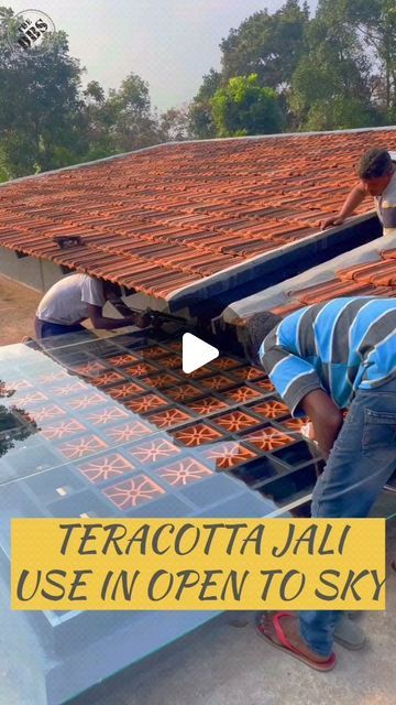 two men working on the roof of a building with text overlay that reads terracotta jail use in open to sky