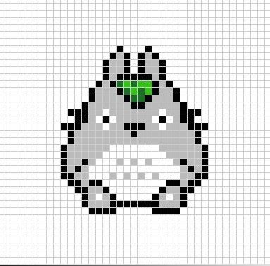 a cross stitch pattern with an image of a cat's head in the middle