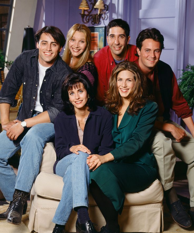 the cast of friends posing for a photo