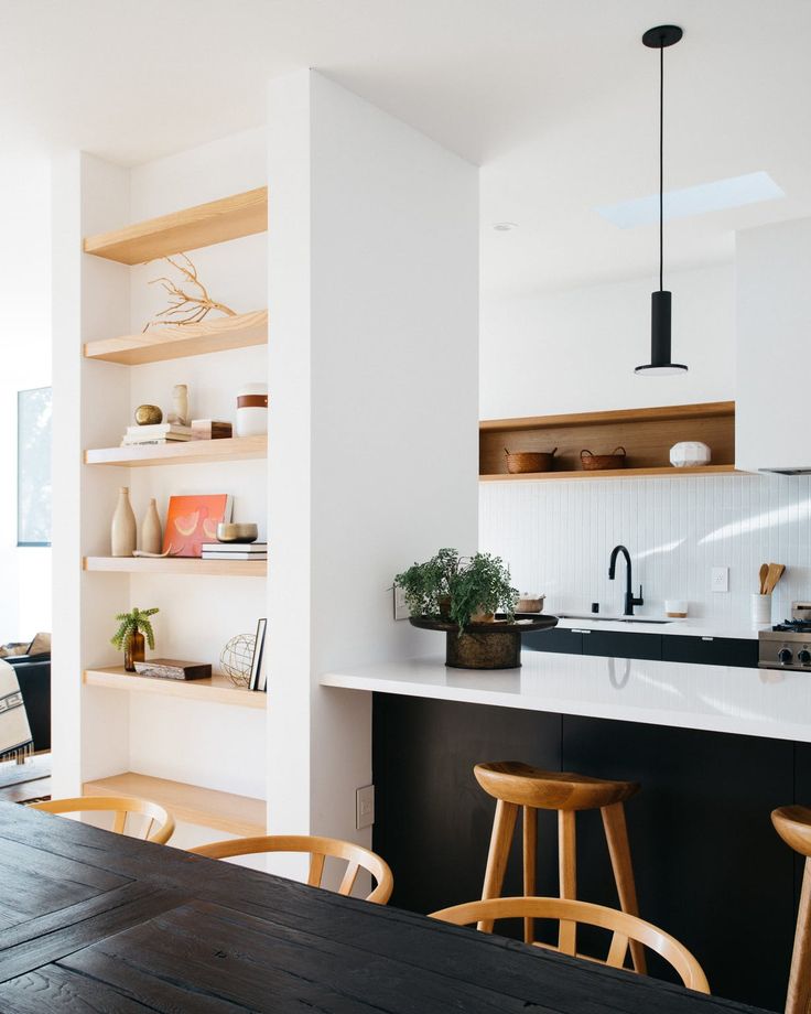 the kitchen is clean and ready to be used as a dining room or living room