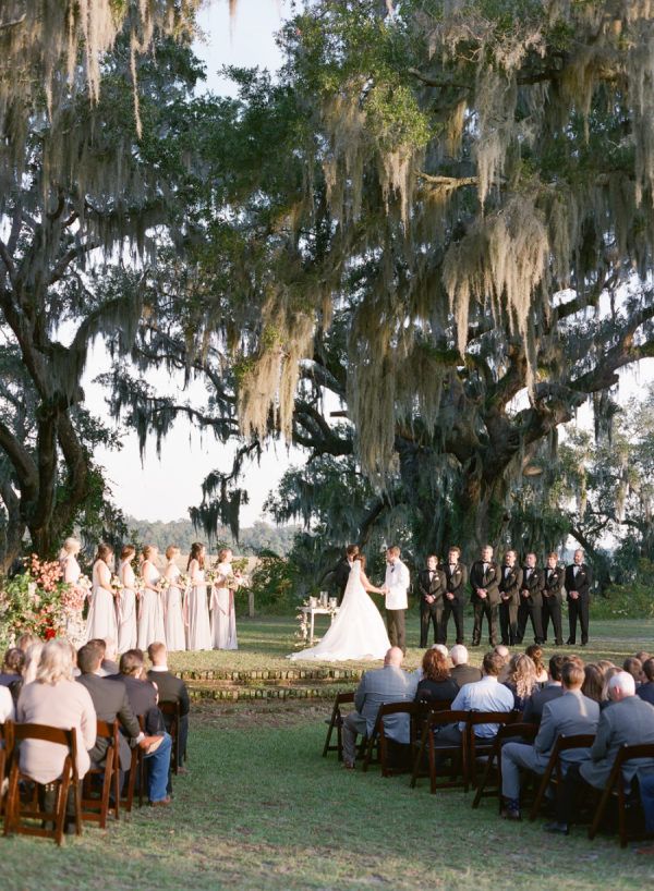 a wedding ceremony in the middle of a field