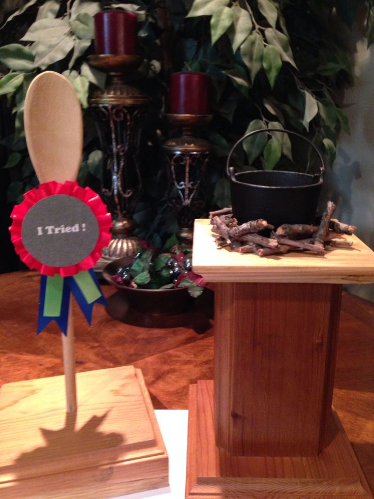 a wooden table topped with an award ribbon