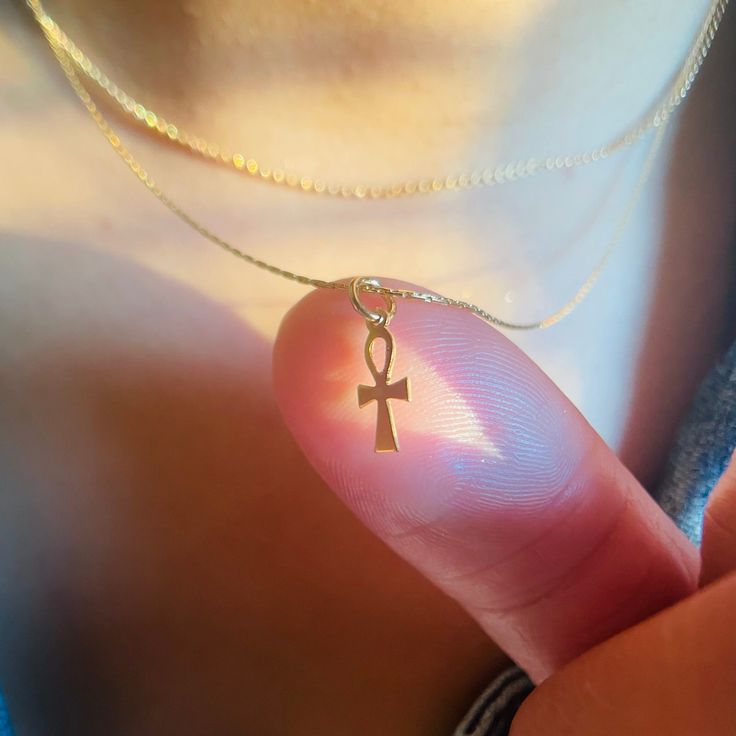 ** Need a Gift Idea? PeaceofStoneHandmade© Unique Jewelry is beautifully Eco- Consciously packaged- ready for gift giving to your someone special! A small Ankh cross on a dainty gold chain.  This tiny cross Pendant Necklace is subtle and elegant.  The Ankh cross is symbolic of life. * 14K Gold Filled * Tiny Ankh Cross * Lobster clasp H O W * IT'S * M A D E Handmade in Virginia, USA with great care, intention and gratitude. 🕊Shauna * Each piece from my jewelry collection is special and handmade Spiritual Nickel-free Charm Necklace For Her, Personalized Spiritual Necklaces As Gifts, Nickel-free Cross Pendant Necklace As Gift, Adjustable Dainty Charm Necklace As Gift, Personalized Cross Pendant Jewelry Gift, Personalized Cross Pendant Jewelry For Gifts, Spiritual Ankh Shaped Jewelry For Gifts, Spiritual Charm Necklace With Delicate Chain, Spiritual Ankh Jewelry Gift