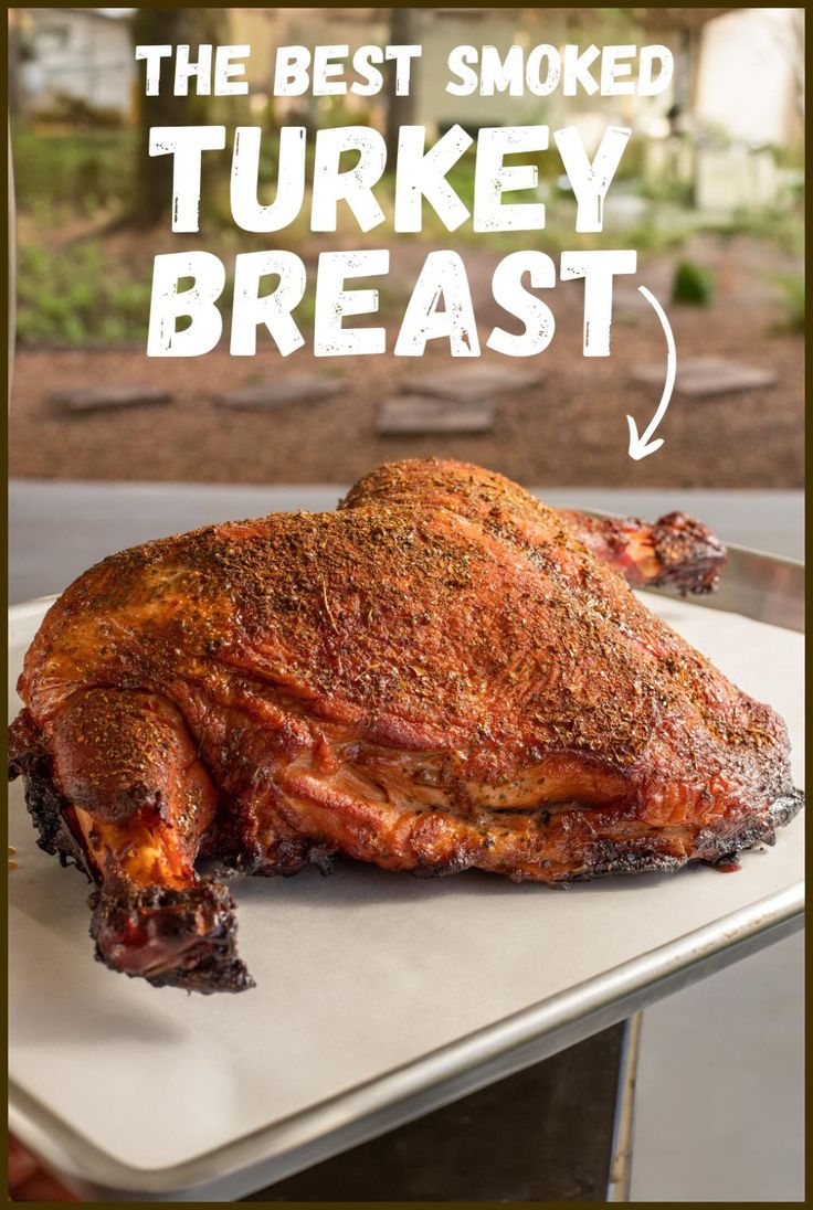 the best smoked turkey breast is on a white platter with text overlay that reads, the best smoked turkey breast