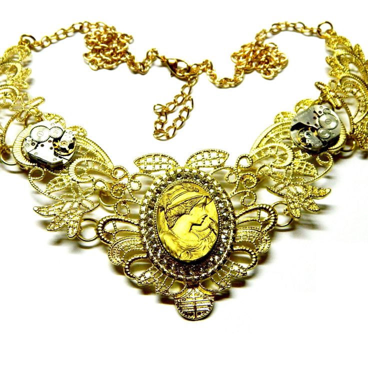 Golden metal lace collar, steampunk necklace choker, including two old miniature clockworks, Gray-black or Golden or beige-cream colored Goth Lady cameo woman with the rose or hat. On your request with or without clockworks. All parts are of high quality. Dimensions of the collar 5" x 5" / 12.5 cm x 12.5 cm Length of the chains 14" (+2") / 35 cm (+ 5 cm) Cameo 1" x 3/4" / 2.5 cm x 2 cm Clockworks 5/8" / 1.5 cm more: https://www.etsy.com/shop/EmilySteampunk?section_id=19893317 Please take a momen Steampunk Wedding, Punk Jewelry, Steampunk Necklace, Metal Lace, Jewelry Choker, Birthday Jewelry Gift, Lace Collar, Cream Color, Happy Shopping