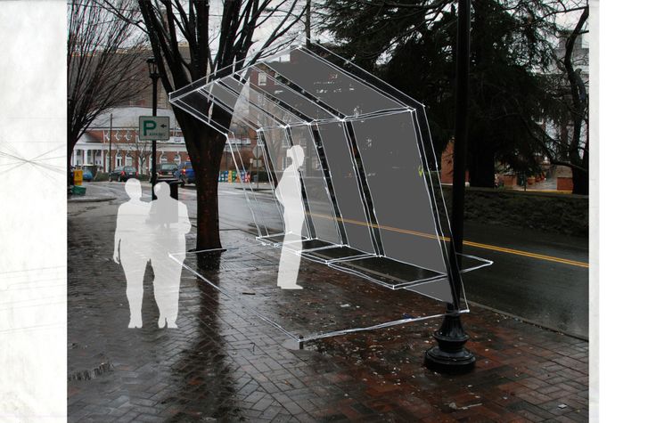 two people standing in front of a large screen on the side of a city street