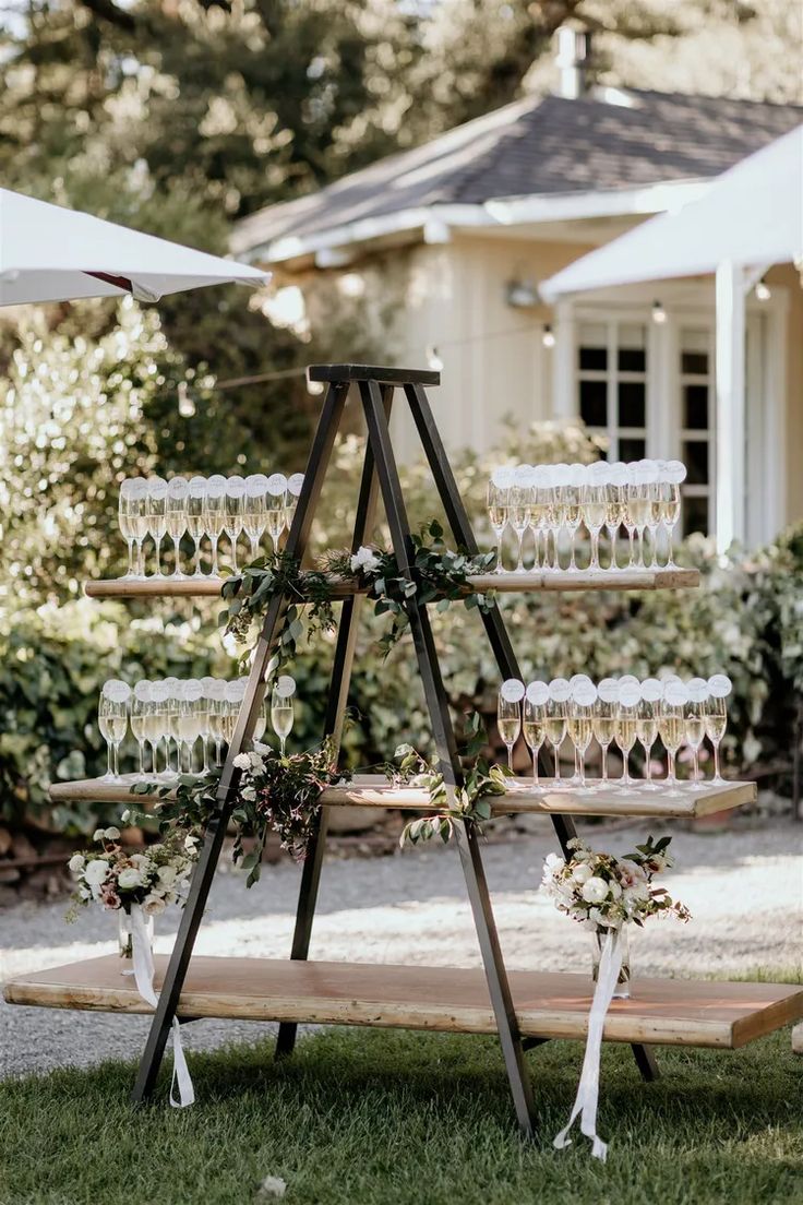 a wooden stand with wine glasses on it