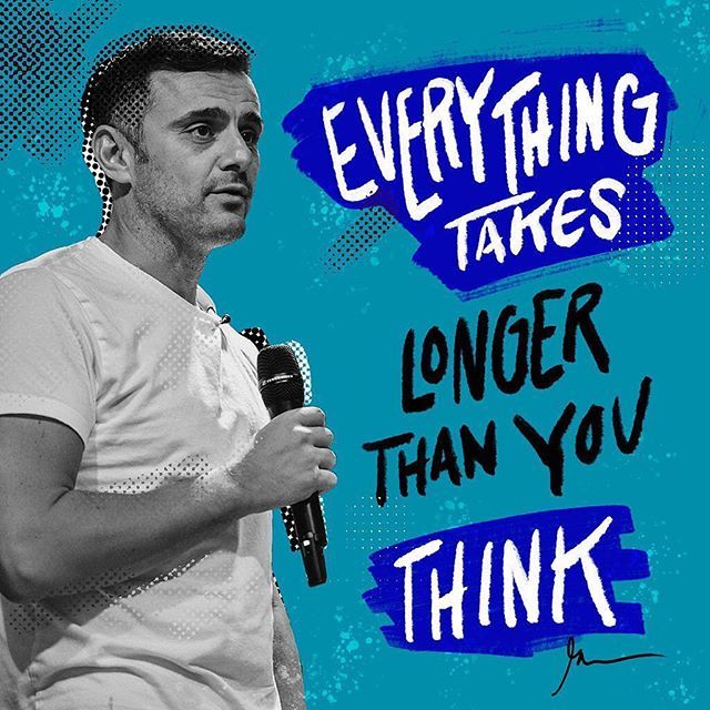 a man standing in front of a microphone with the words everything takes longer than you think