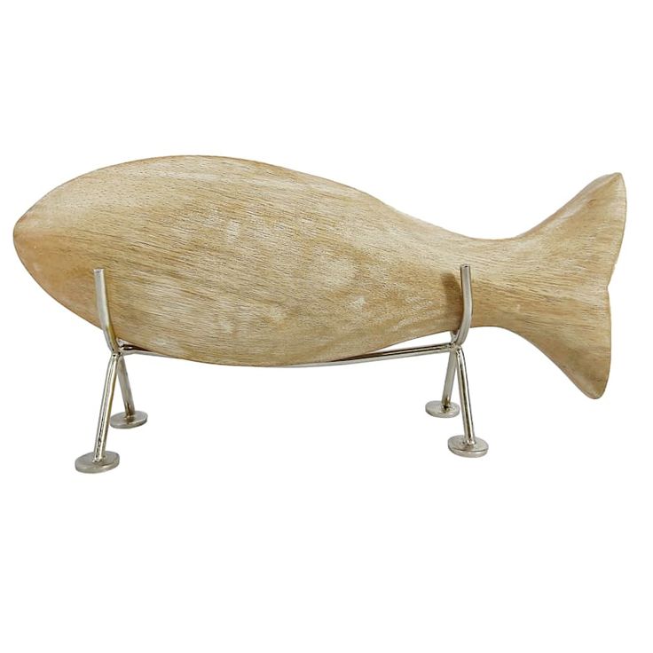 a wooden fish sculpture sitting on top of a metal stand