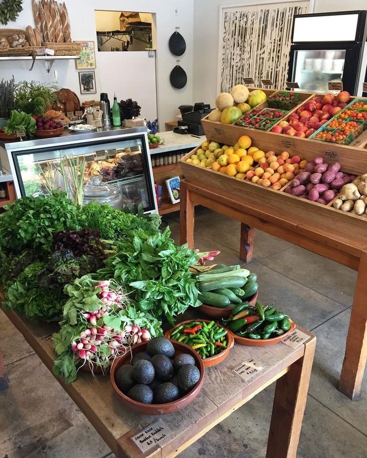 a table filled with lots of different types of fruits and vegetables next to each other