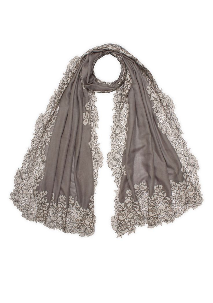 Handcrafted to perfection, this mousse scarf harmoniously blends the softness of wool and smoothness of silk for that luxurious feel against your skin. However, the true allure of this scarf lies in its exquisite tonal mousse corded lace border, which brings out the vintage charm and timeless elegance of this signature creation. Wrap yourself in warmth and style, as this scarf becomes the centerpiece of your ensemble. Elegant Winter Pashmina Shawl, Elegant Cream Pashmina Shawl, Elegant Pashmina Shawl For Evening, Luxury Beige Scarf For Formal Occasions, Luxury Beige Formal Scarf, Elegant Silk Shawl For Winter, Elegant Beige Formal Shawl, Elegant Winter Evening Scarves, Elegant Formal Pashmina Scarves