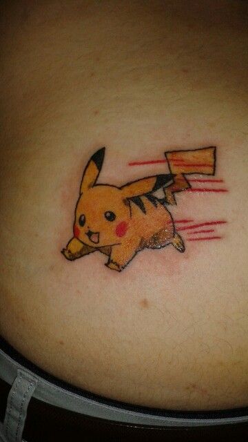 a woman's stomach with a pikachu tattoo on it