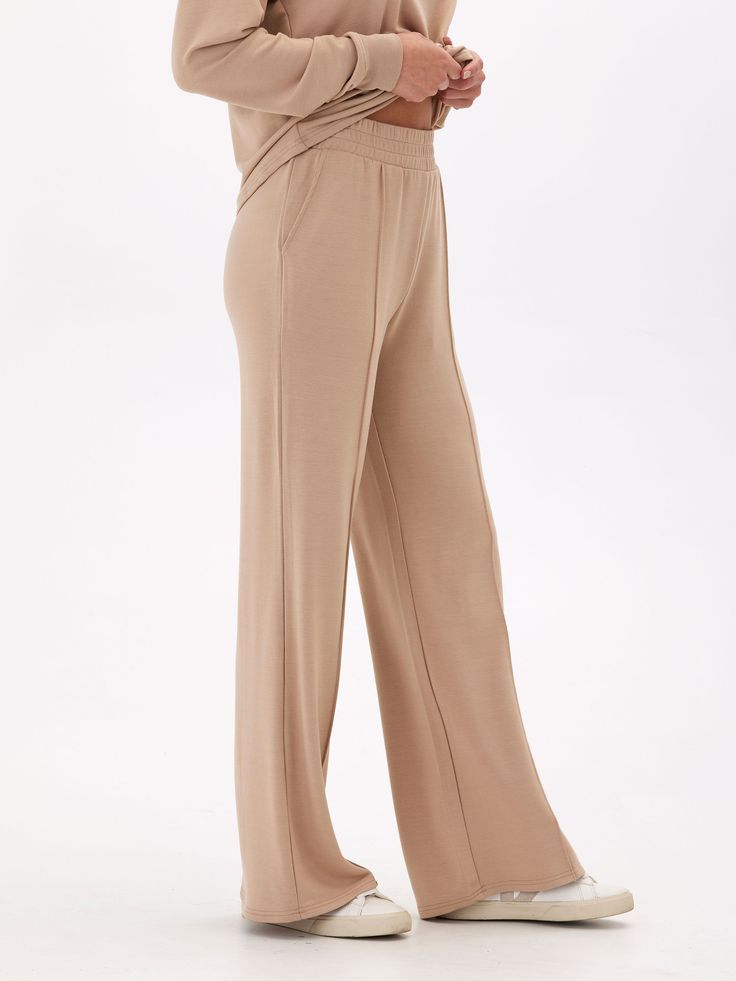 Elevate your loungewear game with our Angela Modal Terry Wide Leg Pants! Made with a buttery soft material and featuring a thick stretchy waistband, these pants offer both comfort and style. The wide leg design adds a touch of elegance to your casual look. Don't settle for ordinary loungewear, treat yourself to our elevated piece. Solid Wide-leg Yoga Pants For Lounging, Relaxation Wide Leg Yoga Pants With Elastic Waistband, Comfort Waistband Yoga Pants For Lounging, Wide Leg Comfort Stretch Pants For Lounging, Comfort Stretch Wide Leg Lounge Pants, Comfortable Solid Color Lounge Pants, Comfort Stretch Wide Leg Pants For Lounging, Comfortable Wide Leg Yoga Pants For Loungewear, Solid Yoga Pants With Elastic Waistband For Relaxation