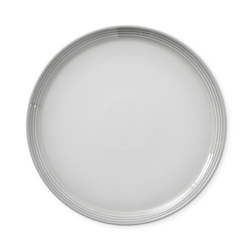 an empty white plate on a white background