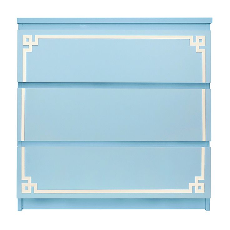 a blue book shelf with white trim and greek designs on the top, against a white background