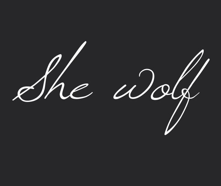 the word she wolf written in white ink on a black background