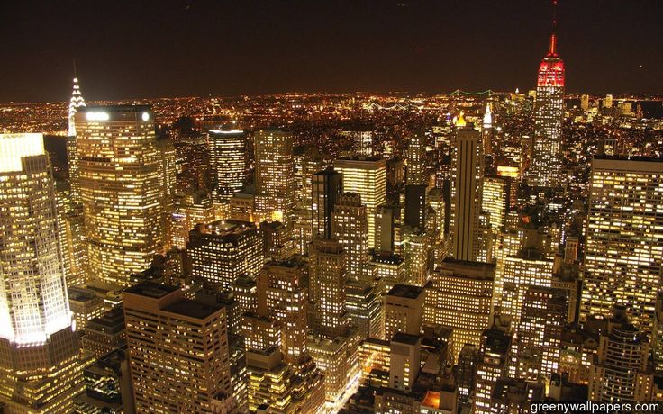 an aerial view of new york city at night from the top of the empire building