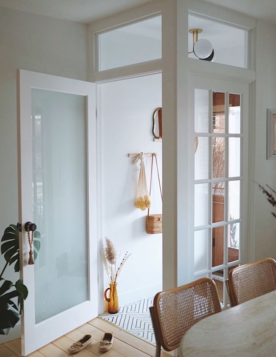 an open door leading to a dining room