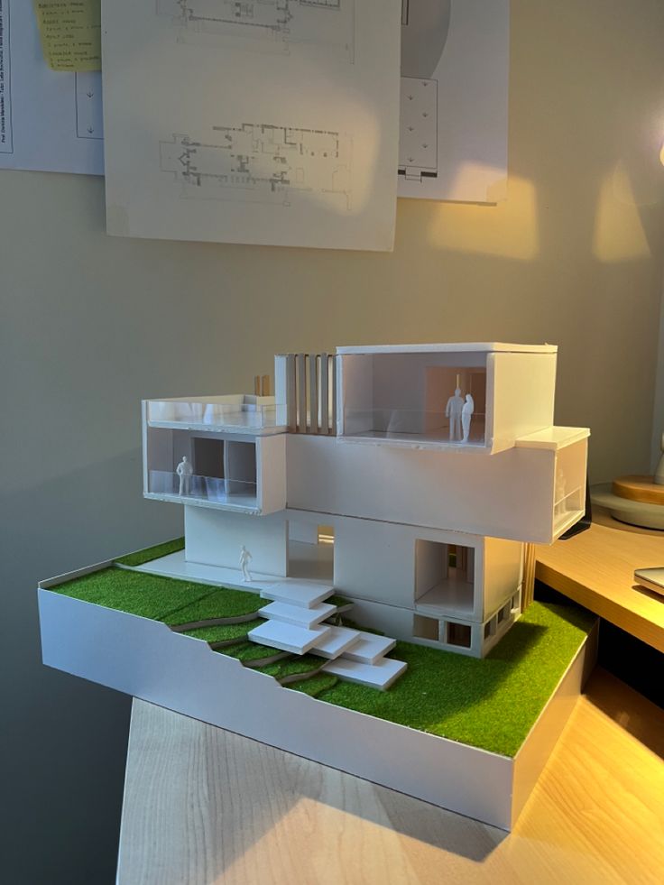 a model of a house sitting on top of a table