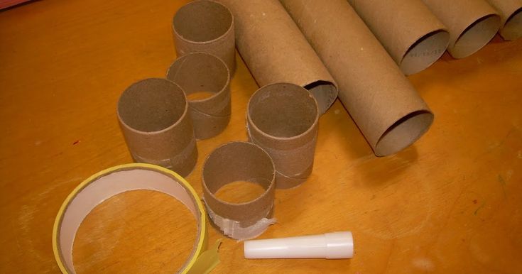 several rolls of toilet paper and some tape on a table