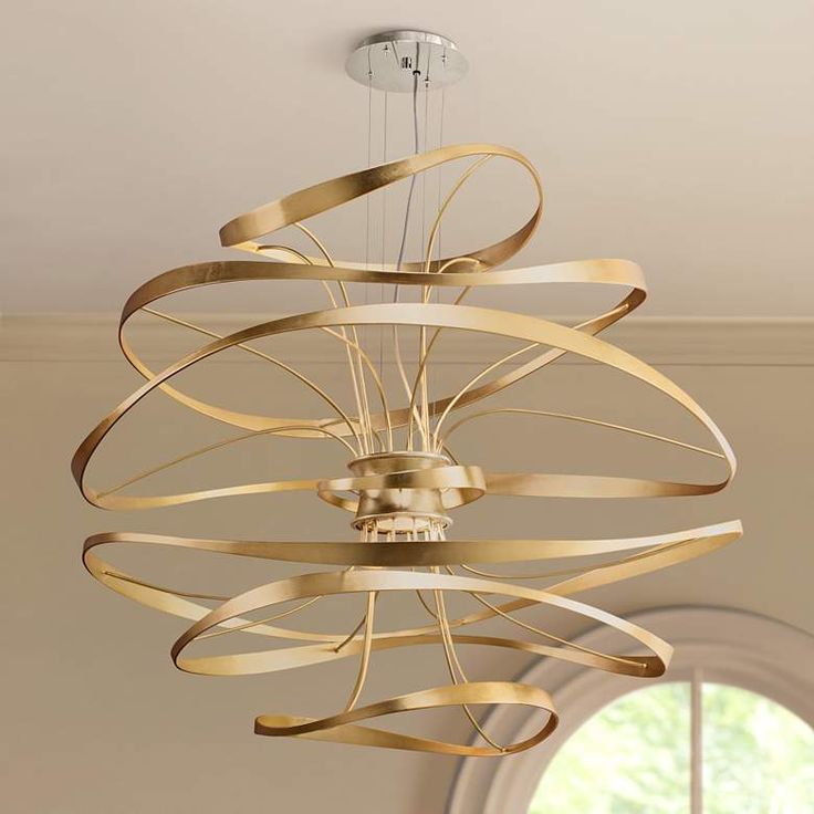 a modern chandelier hanging from the ceiling