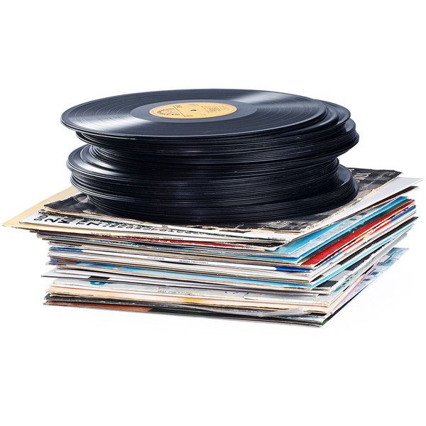 a stack of records and vinyls on top of each other