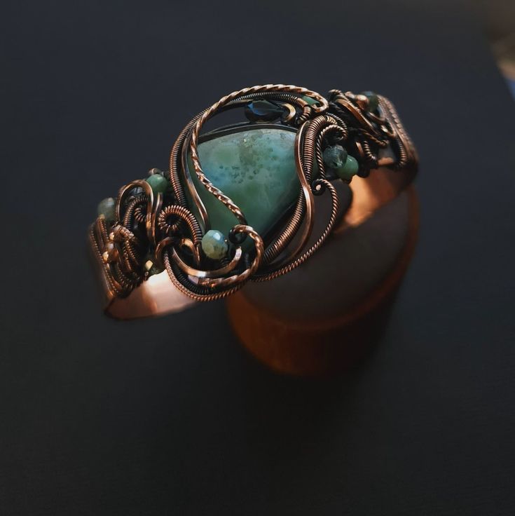 Handcrafted copper cuff bracelet caribbean larimar gemstone, smooth, unique shape, genuine gemstone  london blue topaz teardrop accent  glass & copper accent beads  1/2" wide hand formed copper cuff band, adjustable fit  pure copper wire wrapped, oxidized for an antiqued finish, tumlbed and polished  unique wearable art {ocean inspired} 🌊 comes nicely packaged with a business card, jewelry care instructions and a polishing cloth Elegant Bronze Bangle, Elegant Amazonite Jewelry Gift, Elegant Bronze Bangle Jewelry, Elegant Amazonite Jewelry For Gifts, Bohemian Amazonite Jewelry Gift, Handmade Adjustable Aquamarine Bracelet, Elegant Wire Wrapped Copper Cuff Bracelet, Elegant Copper Wire Wrapped Cuff Bracelet, Spiritual Electroformed Turquoise Jewelry