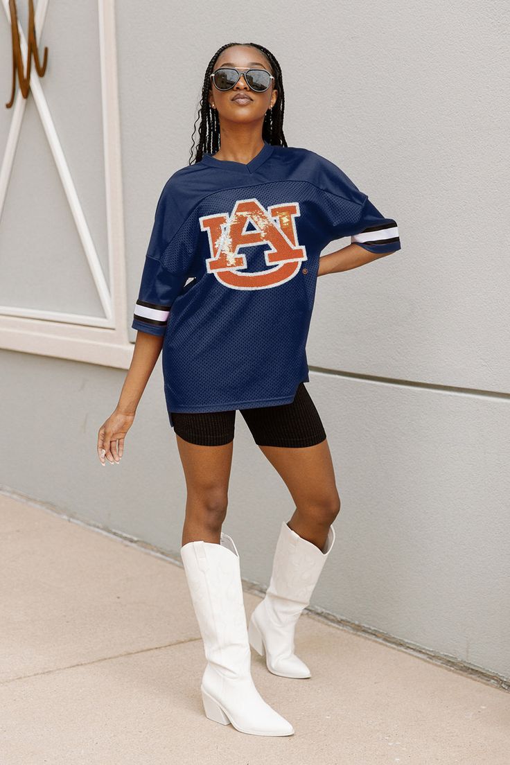 This iconic oversized fashion jersey is the perfect addition to any wardrobe. It features a classic design with a modern twist, making it a timeless piece. The jersey is made from a lightweight and breathable fabric, making it comfortable to wear all day. It also features a unique OPTION PLAY logo on the front, adding a stylish touch. With its oversized fit, this jersey is sure to make a statement. Whether you're hitting the streets or the gym, this jersey is sure to turn heads. Play Logo, Oversized Fashion, Auburn Tigers, Fabric Making, Auburn, The Streets, Jersey Fabric, Tigers, Oversized Fits