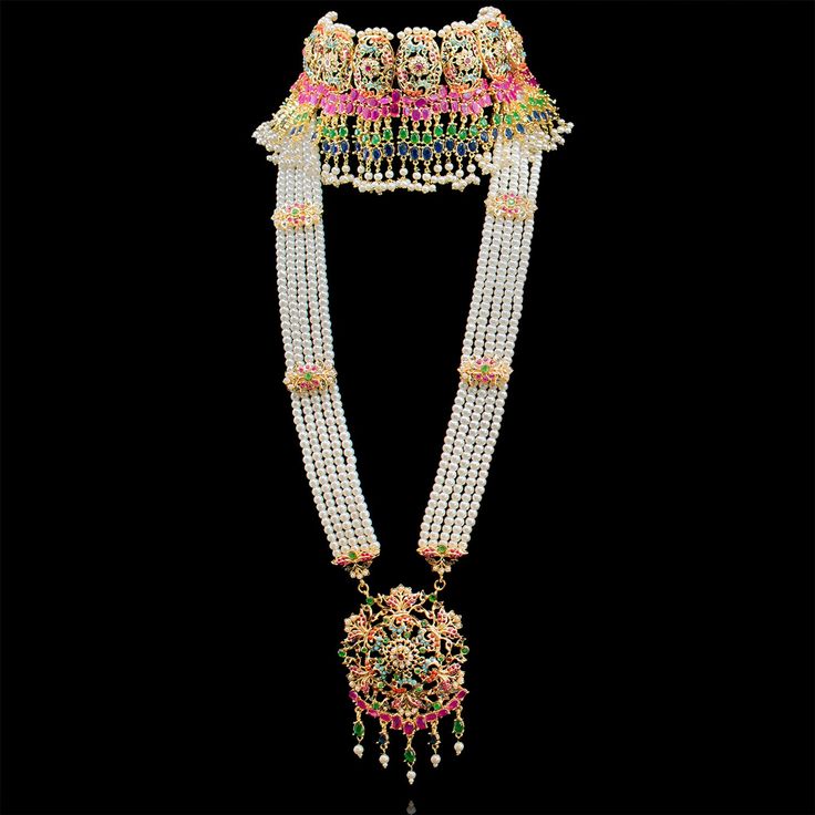 Classy and always timeless, our Aanifa Set brings you modern bridal jewelry that you can wear through wedding season and beyond! A beautiful bridal set exquisitely crafted with nauratan stones and white pearl moti. The set includes a matching maang teekah, a jhoomar and a pair of beautiful earrings. Approximate earrings length is 4". This set is available in two options: Set with Jhoomar Set without Jhoomar Please select the desired option at the time of purchase. This set can be paired with Zeh Modern Bridal Jewelry, Modern Bridal, Bridal Set, Bridal Sets, White Pearl, Wedding Season, Festival Captain Hat, Pearl White, Beautiful Earrings