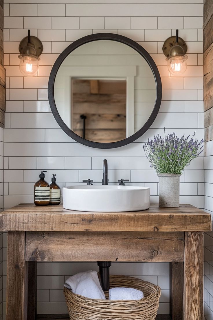 a bathroom sink with a mirror above it and a basket underneath the sink in front of it