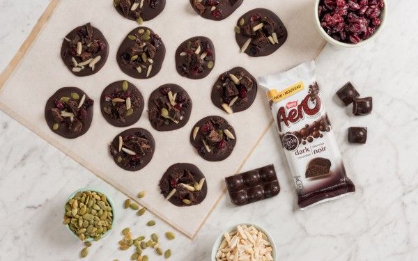 chocolates, nuts and other ingredients are laid out on a table