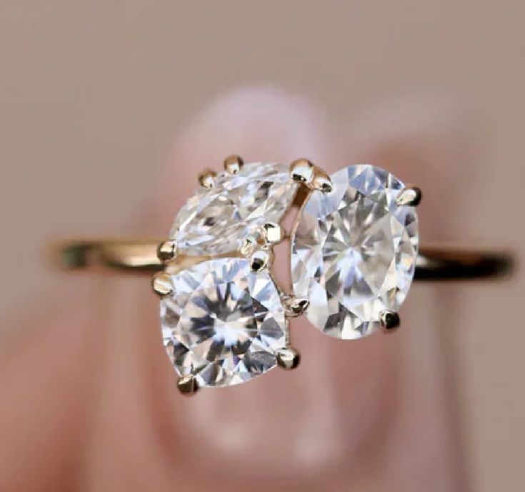 two pear shaped diamond rings on top of each other