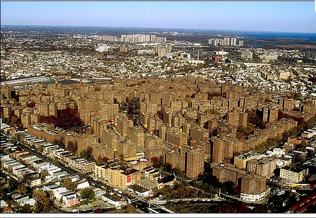 an aerial view of a city with tall buildings